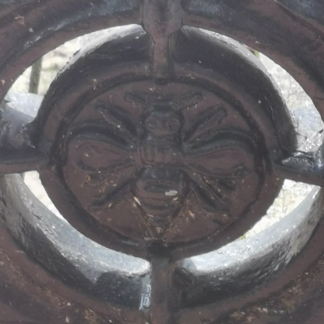 Close up of bee in cast iron bench end, Wellington Place, off Liverpool Road